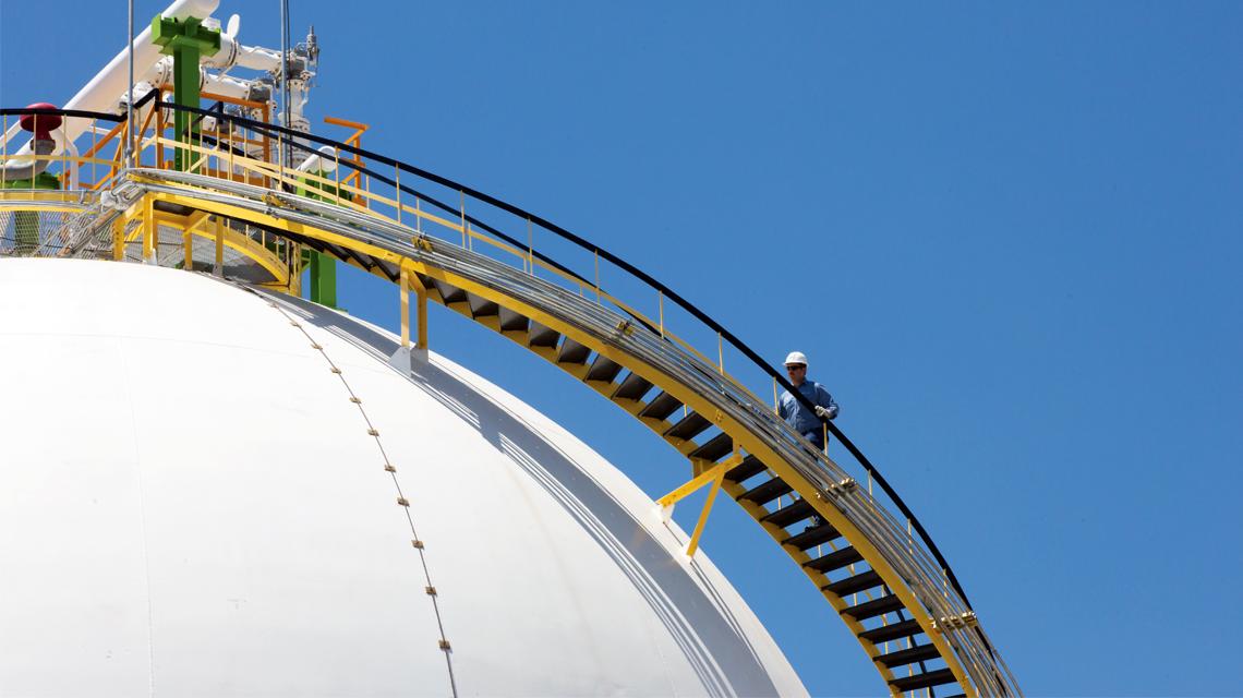 A team member inspects equipment at IEnova's liquid fuels storage facility